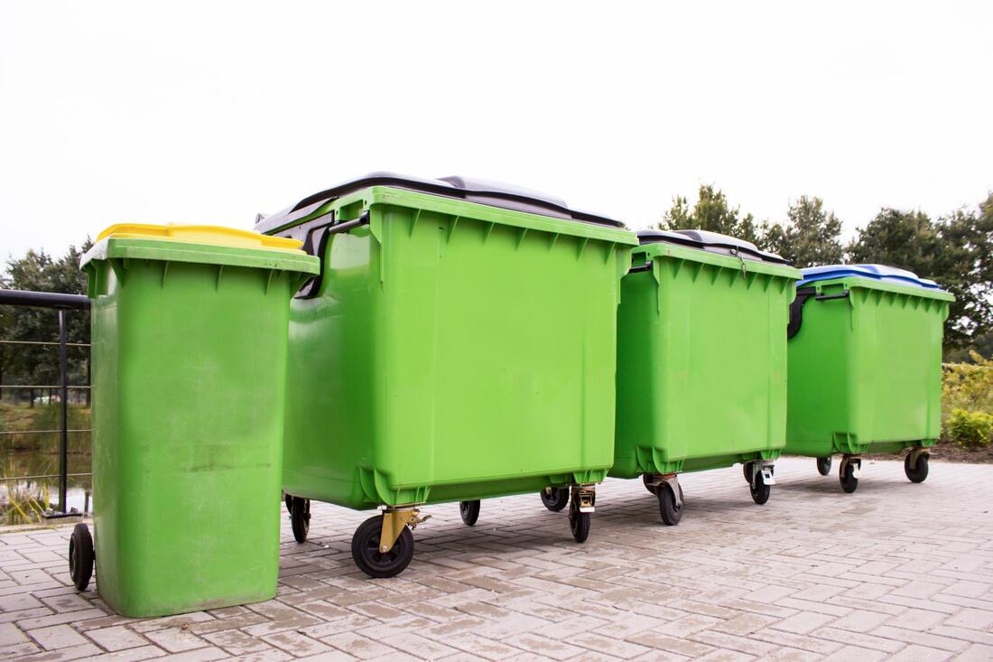 a four green dumpster
